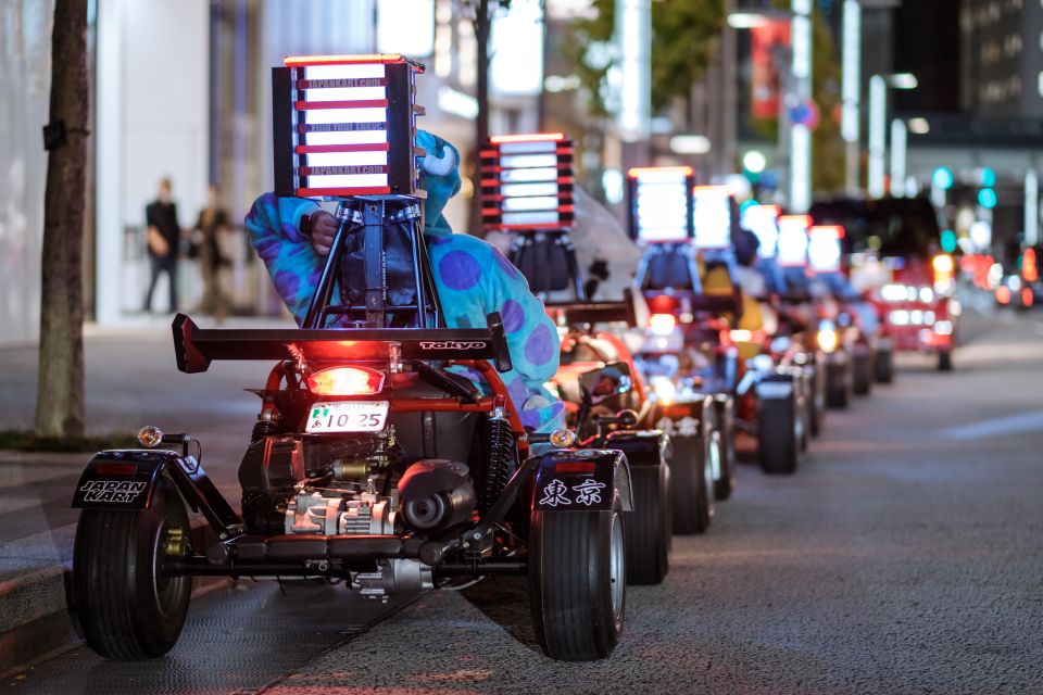 Tourist dressed in costumes driving in go-karts around Tokyo.